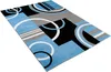 A rectangular rug with a modern geometric pattern, displayed on a white background. Voir les images du produit