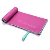 A pink microfiber towel rolled up on one end and laid out flat on a white background. Produktbild-Vorschau
