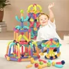 A young boy is playing with magnetic building blocks, creating colorful structures. Náhled obrázku produktu