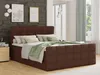 A bedroom scene with a brown boxspring bed. Podgląd zdjęcia produktu