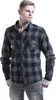 A man wearing a plaid shirt and jeans, posing against a white background. Produktbild-Vorschau