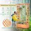 A child watering flowers in a wooden planter box with a trellis in a forest setting. Podgląd zdjęcia produktu