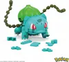 A toy building set of the Pokemon character Bulbasaur, with loose building blocks scattered around it. Produktbild-Vorschau