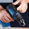 A person's hands are holding and operating a cordless drill. Produktbild-Vorschau