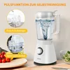 A white blender is shown on a wooden surface, with inset images demonstrating cleaning features and fresh ingredients nearby. Produktbild-Vorschau