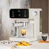 A white espresso machine is shown on a countertop, with a cup of espresso being brewed. Voir les images du produit