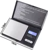 A black digital scale with a silver weighing platform, shown open with dimensions indicated. The lid displays instructions in white text. Produktbild-Vorschau