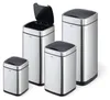 A set of four metallic sensor trash cans of varying sizes with black lids, displayed against a white background. Podgląd zdjęcia produktu