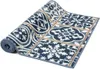 A rolled-up rug with a patterned design. Produktbild-Vorschau