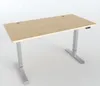 A modern, height-adjustable desk with a light wood top and silver metal legs, presented against a plain white background. Náhľad obrázku produktu