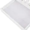 A close-up view of the interior of a white wooden drawer, possibly from a bed or crib. Náhľad obrázku produktu