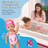 A mother and daughter are playing with a baby doll in a bathtub. The doll is wearing a pink swimsuit and cap. Produktbild-Vorschau