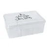 A clear, well-lit studio shot of a transparent plastic tea box with a lid, divided into six compartments. The lid has text printed on it. Náhľad obrázku produktu