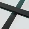 A close-up view of a black frame intersecting with a glass surface, suggesting a window or door. Náhled obrázku produktu