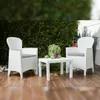 Outdoor patio furniture set with two chairs and a table, surrounded by greenery. Produktbild-Vorschau