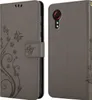 A grey flip phone case with a floral and butterfly design is shown from the front and back. Náhľad obrázku produktu