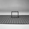 A LEGO® brick frame with a transparent window is placed on a LEGO® baseplate. Podgląd zdjęcia produktu
