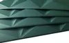 A stack of green 3D wall panels with a geometric pattern. Anteprima dell’immagine prodotto