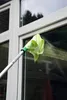A person is cleaning a window with a cleaning tool. Produktbild-Vorschau