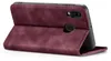 A burgundy flip cover phone case is shown from the side, with the phone inside and the cover open. Produktbild-Vorschau