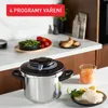 A kitchen counter with a pressure cooker, ingredients, and food. Voir les images du produit