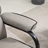 Close-up of a gray armchair armrest with black piping. Produktbild-Vorschau