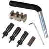 A set of tools for working with saw chains, including a chain breaker, punches, and an Allen wrench, laid out on a white background. Produktbild-Vorschau