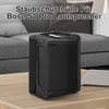 A black protective cover for a Bose S1 Pro speaker is placed on a wooden table in front of a sofa. Produktbild-Vorschau