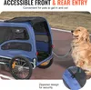 A dog is tethered to a blue pet trailer on a paved path. Voir les images du produit