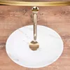 A top view of a white marble-effect sink with a gold faucet. Produktbild-Vorschau
