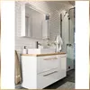 A modern bathroom vanity with a sink, mirror, and shower in the background. Náhled obrázku produktu