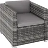 A single gray rattan armchair with gray cushions, shown from a slightly elevated side angle. Produktbild-Vorschau