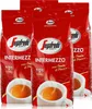 Four bags of Segafredo Intermezzo coffee beans are displayed in front of a white background, with cups of espresso shown at the bottom of the bags. Produktbild-Vorschau