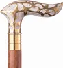 A close-up shot of the handle and upper part of a wooden walking cane with a decorative brass knob. Náhľad obrázku produktu