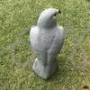 A gray falcon statue is placed on a grassy lawn. Náhľad obrázku produktu