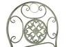 Close-up of the ornate backrest of a vintage-style metal chair. Produktbild-Vorschau