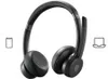 A black Bluetooth headset with a microphone boom is shown against a white background. Icons representing a smartphone and a laptop are visible on either side of the headset, indicating compatibility. Anteprima dell’immagine prodotto