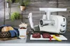 A kitchen scene with a meat grinder, ingredients, and bread. Anteprima dell’immagine prodotto
