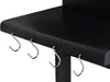 A close-up view of the side of a black grill, showing several silver S-hooks hanging from the underside of the shelf. Produktbild-Vorschau