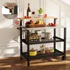 A kitchen cart with various items on it, set against a white paneled wall. Náhled obrázku produktu