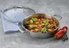 A serving pan filled with ratatouille, a glass lid, a blue napkin, and a red pepper on a gray surface. Podgląd zdjęcia produktu