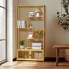 A yellow bookshelf with various items on it, placed near a window with sunlight streaming in. Produktbild-Vorschau