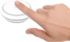 A hand is pressing a white button on a white device. Voir les images du produit