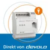 A promotional image for a Devolo Magic LAN device. The product is shown in the center with graphic overlays and text at the bottom. Produktbild-Vorschau