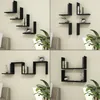 A collage of four images showing different configurations of black wall shelves mounted on a light-colored wall, with some shelves holding books and decorative items. Podgląd zdjęcia produktu
