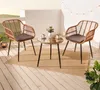 A small bistro set with two chairs and a table on a wooden deck, decorated with string lights. Produktbild-Vorschau