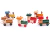 A collection of small, wooden train ornaments arranged on a white background. Podgląd zdjęcia produktu