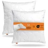 Two white pillows are shown, one in front of the other, with an orange band across the front pillow displaying product information. Produktbild-Vorschau