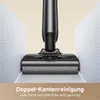 A close-up of a vacuum cleaner head cleaning along a wall and floor junction. Voir les images du produit