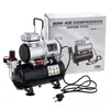 A mini air compressor and its packaging are displayed against a white background. Podgląd zdjęcia produktu